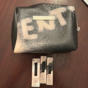 Fenty Beauty bag and three trial size products gloss bomb and hella thick